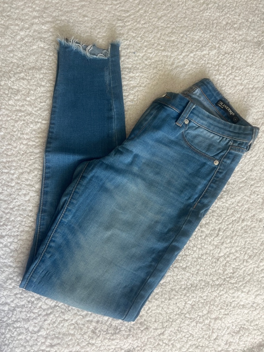 Blank NYC Skinny Jeans in Faded Blue Wash with Raw Hem